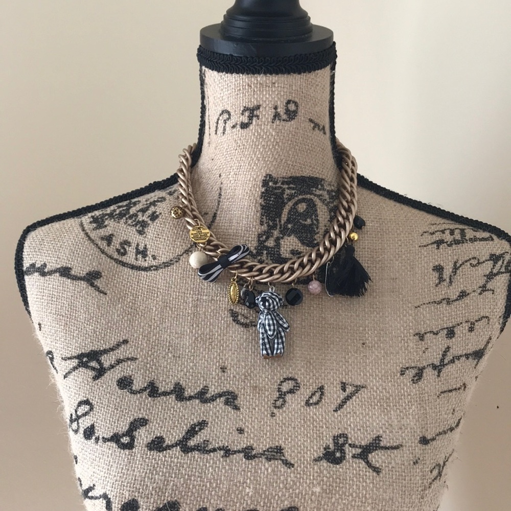 Teddy bear necklace.